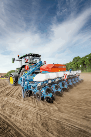 Picture of a Monosem on the back of a John Deere tractor